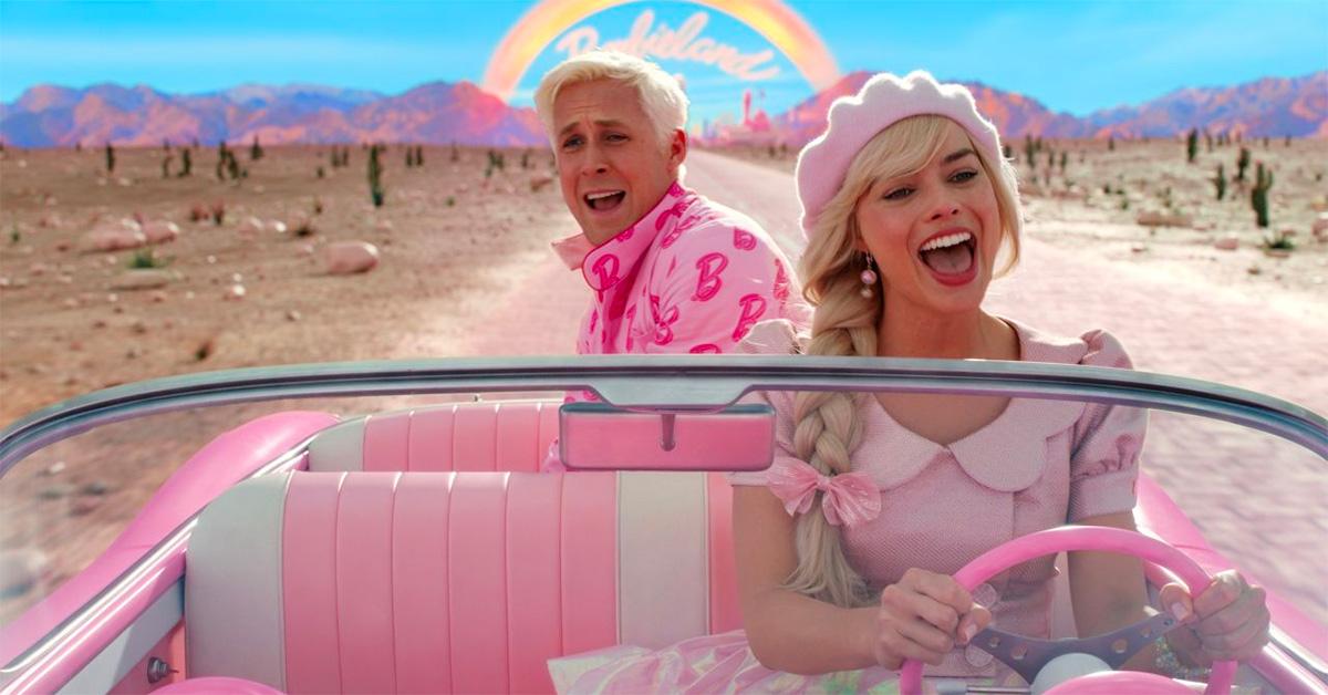 Ryan Gosling and Margot Robbie in a car driving away from Barbieland.