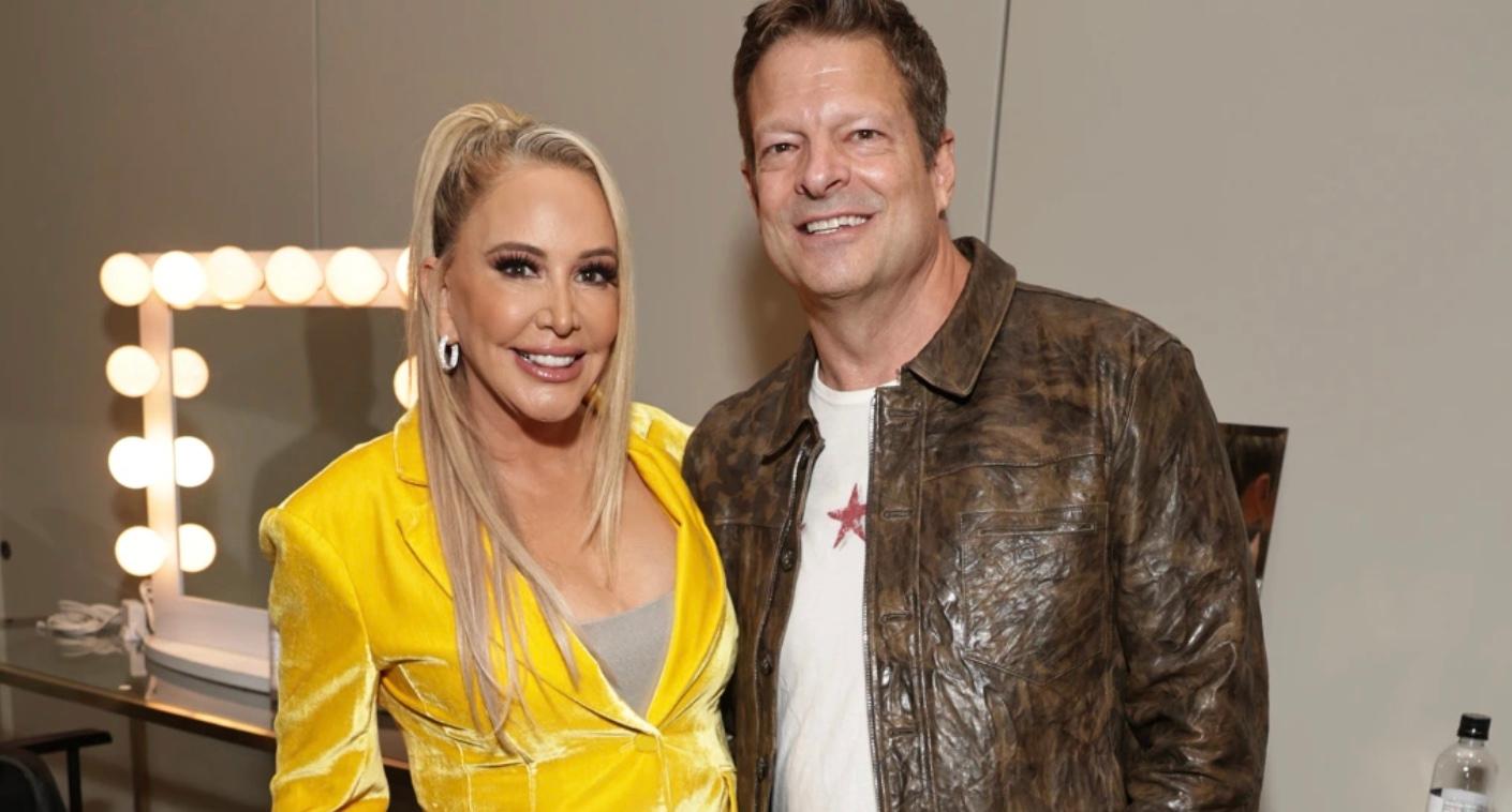Shannon Beador and John Janssen standing in a dressing room