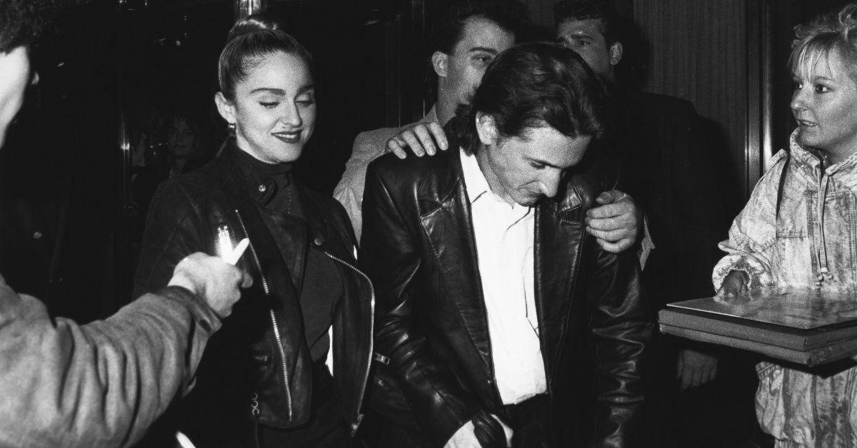 Madonna and Sean Penn walking together at an event.
