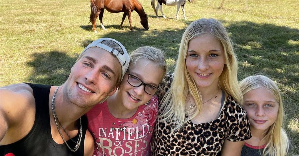 Micah Plath with his three younger sisters