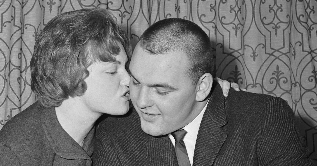 Dick Butkus gets a kiss from his wife Helen after signing with Chicago Bears in 1965