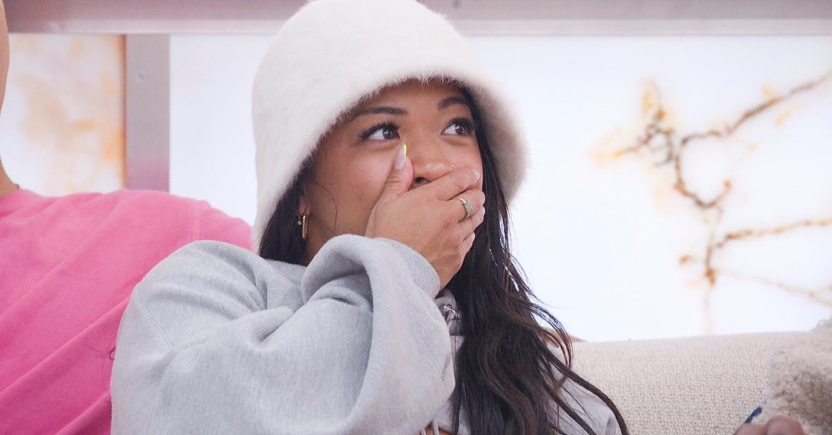 Rubina in a white furry bucket hat on Big Brother