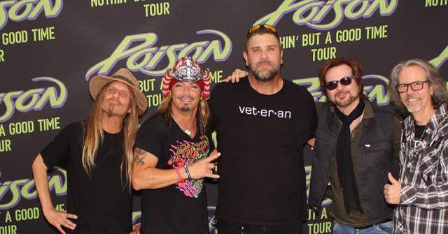 Big John (center) with Bret Michaels and the other members of Poison