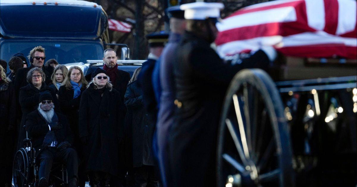 Amy Carter and Jay Kelly amid a crowd of mourners at Jimmy Carter's funeral. 