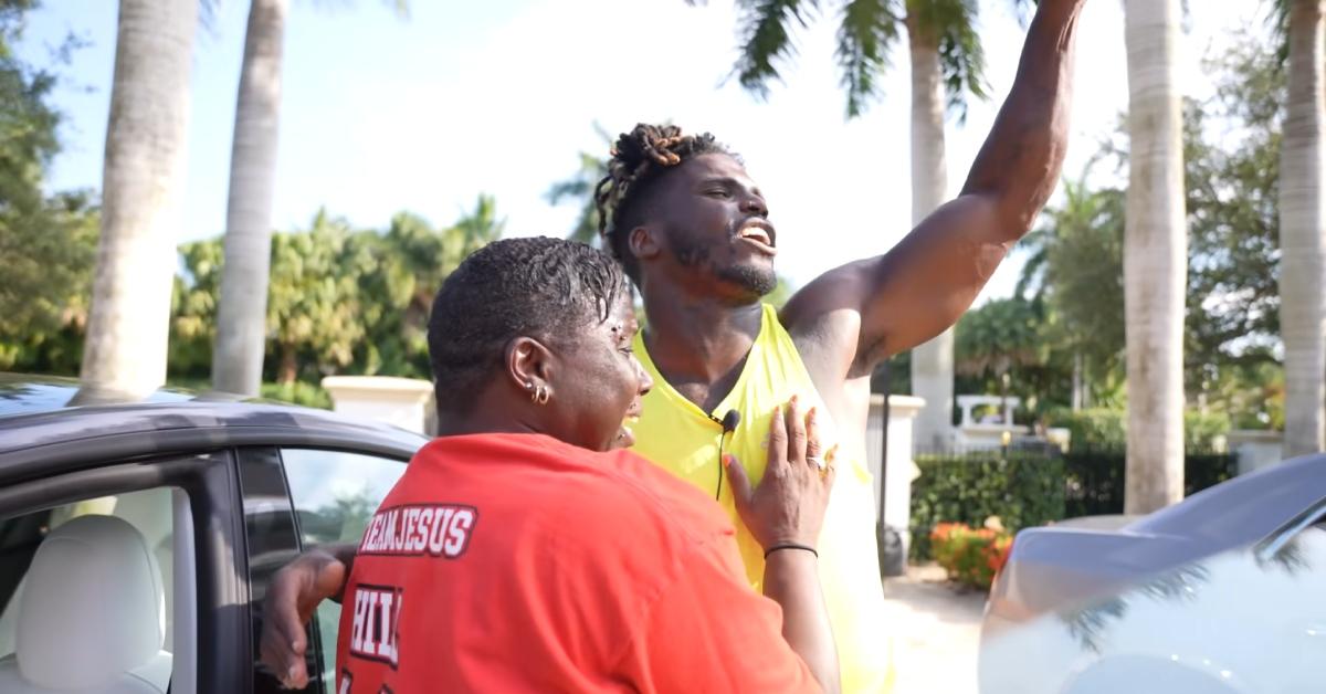 (l-r): Anesha Sanchez and Tyreek Hill celebrating him buying her a car