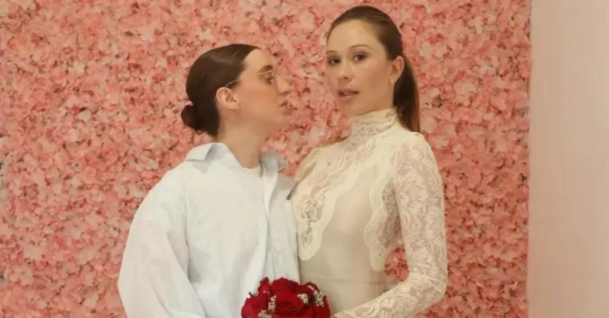 Robby Hoffman and Gabby Windey pose for a photo on their wedding day.