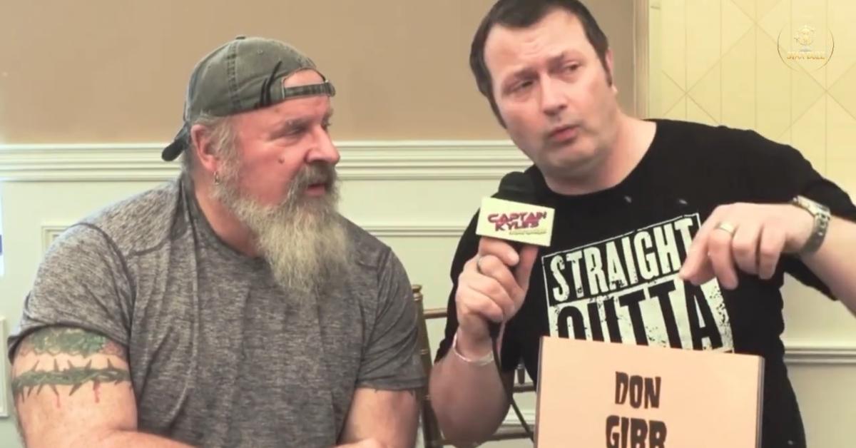 Donald Gibb giving an interview at a convention.