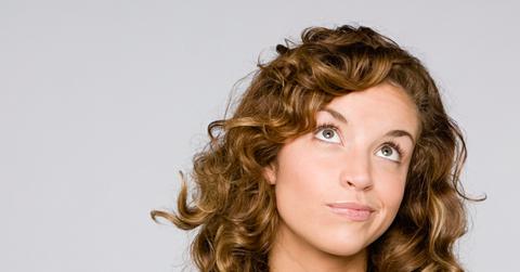 A still shot of curly-haired woman