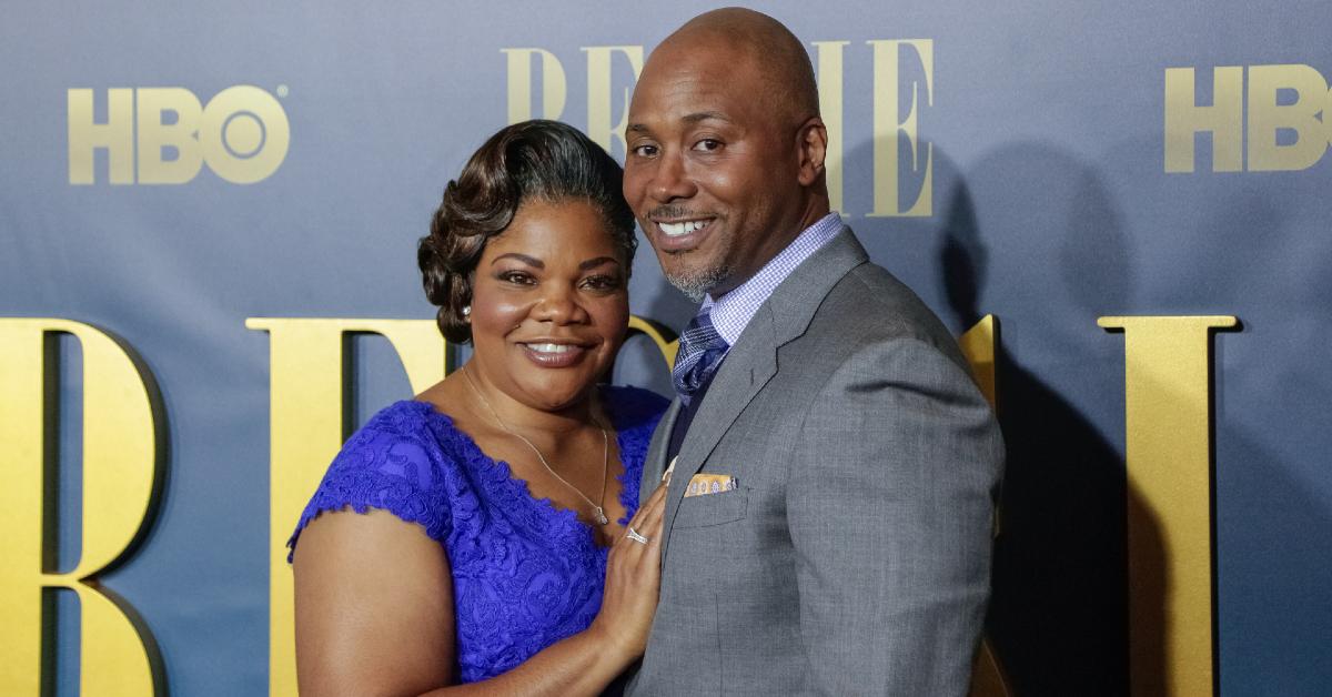 Mo'Nique in blue dress on red carpet with husband Sidney Hicks