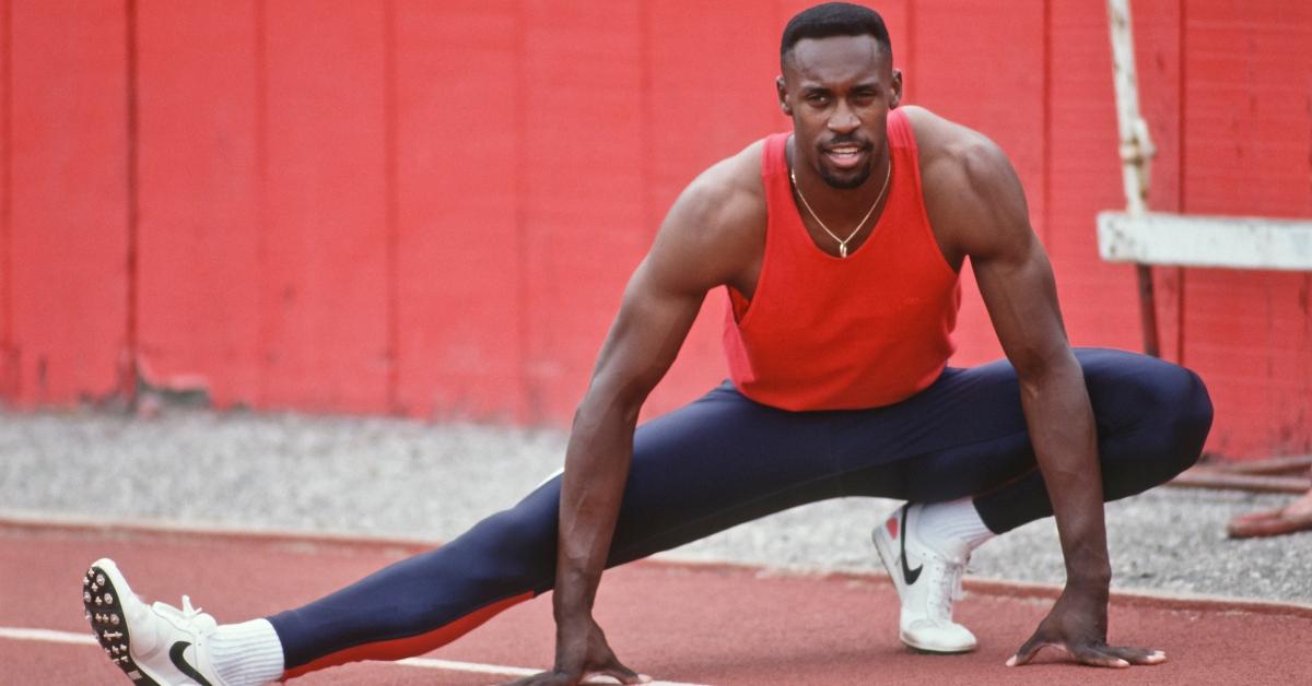 Butch Reynolds stretches at the 1992 Olympics