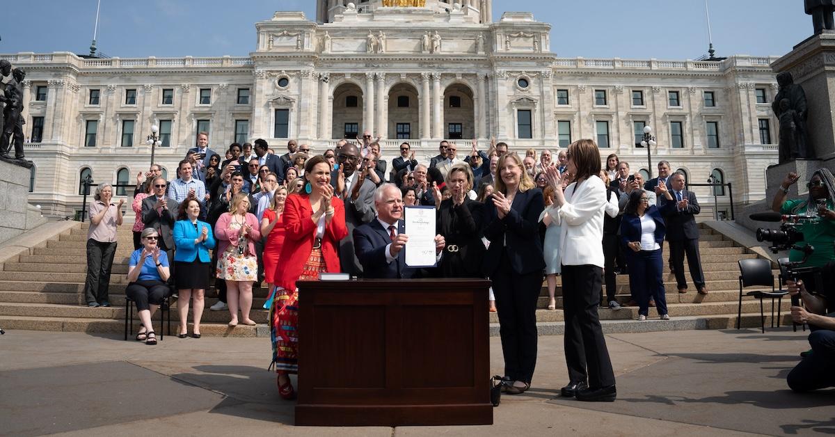 Gwen and Tim Walz at ceremonial budget bill-signing party Wednesday morning on the State Capitol steps (2023)