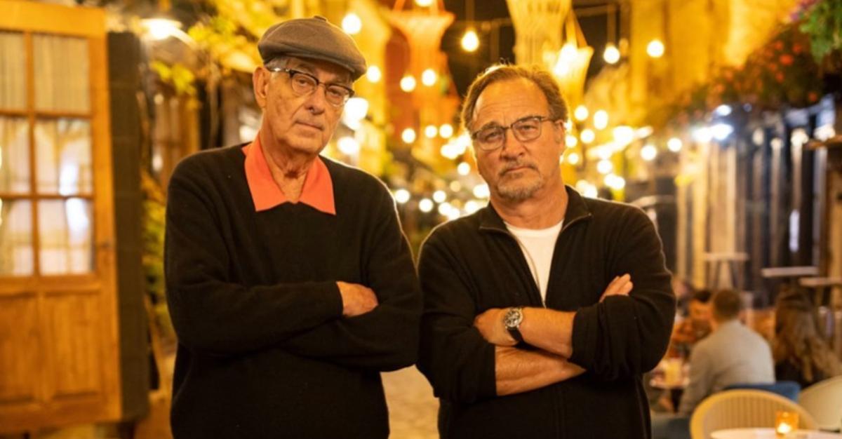 Chris Karakosta standing with cousin Jim Belushi at a restaurant