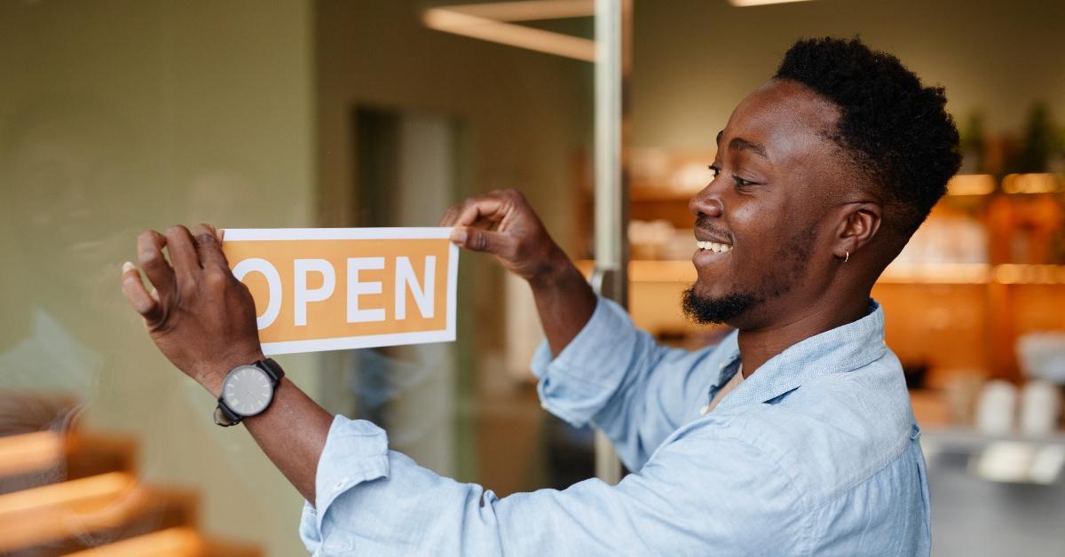 man opening up local business