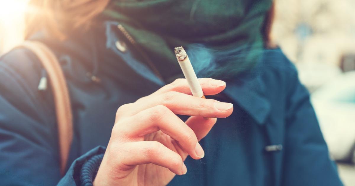 young woman enjoying a cigarette picture id