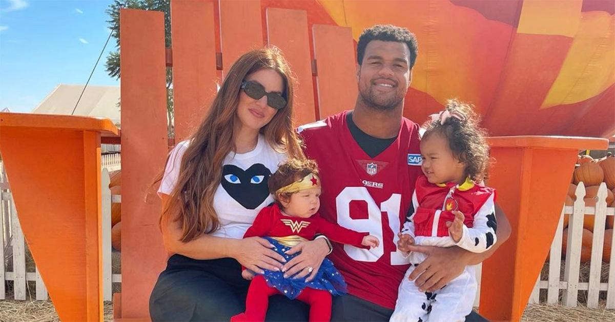 Mindy and Arik Armstead with their two kids at a pumpkin patch. 