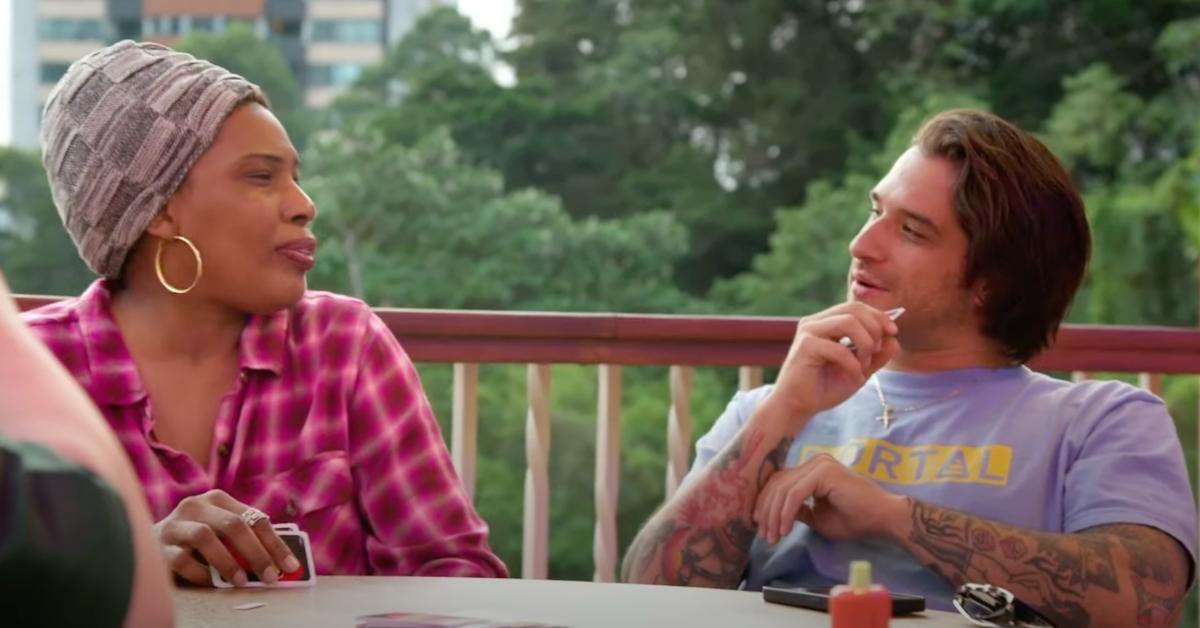 Macy Gray in conversation with Tyler Posey during a card game on 'The Surreal Life: Villa of Secrets'