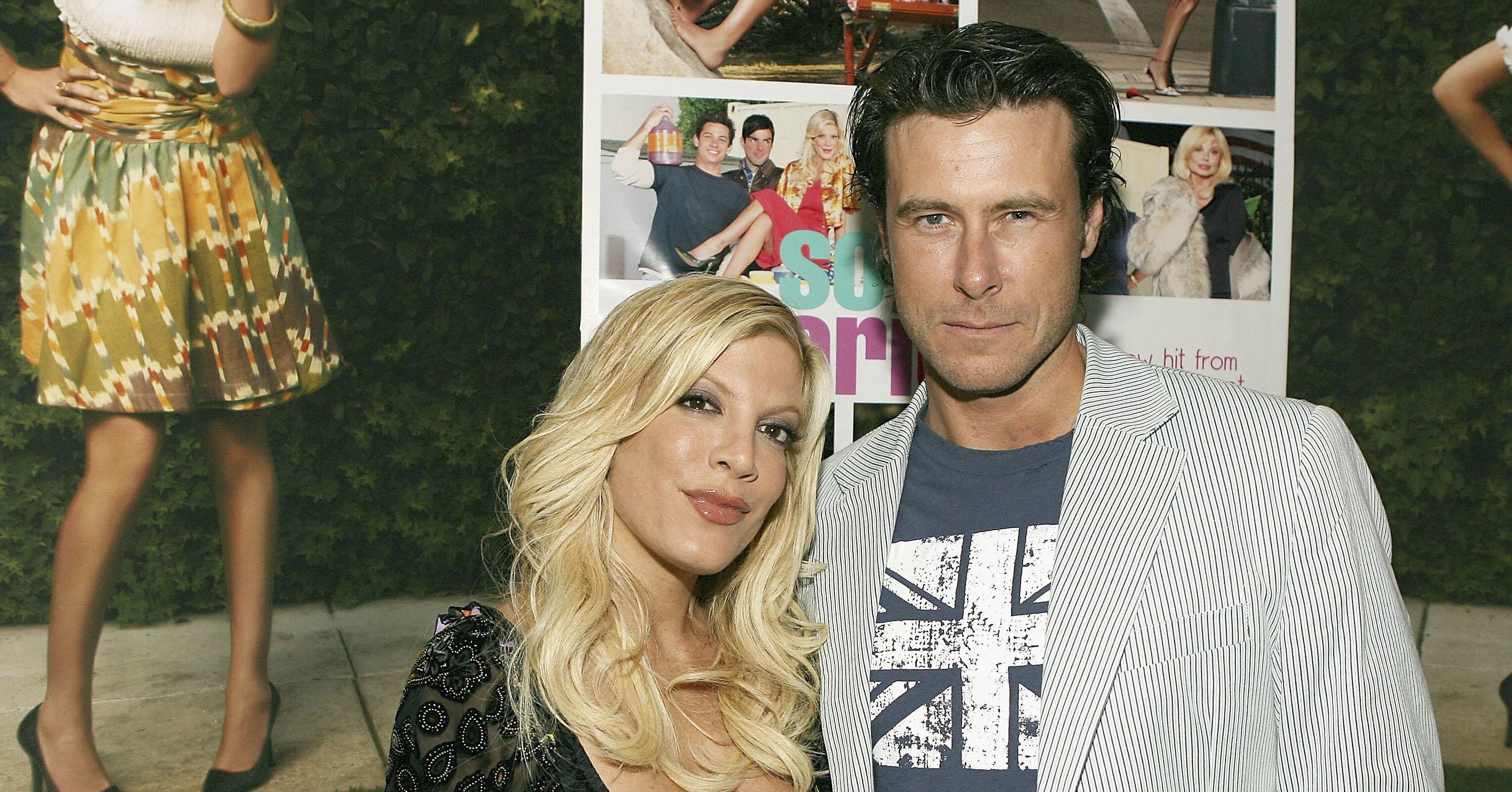 Tori Spelling and Dean McDermott pose on a red carpet in the early days of their marriage. 