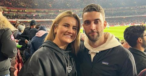 Lindsey Horan and Tyler Heaps in a soccer stadium.