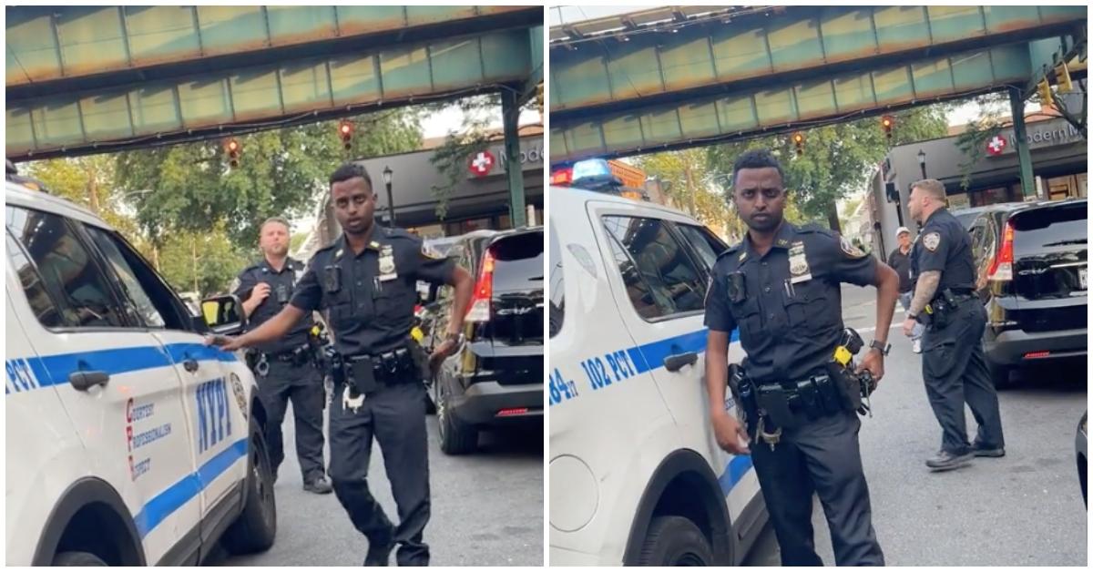 Two NYPD cops get yelled at for blocking the road.