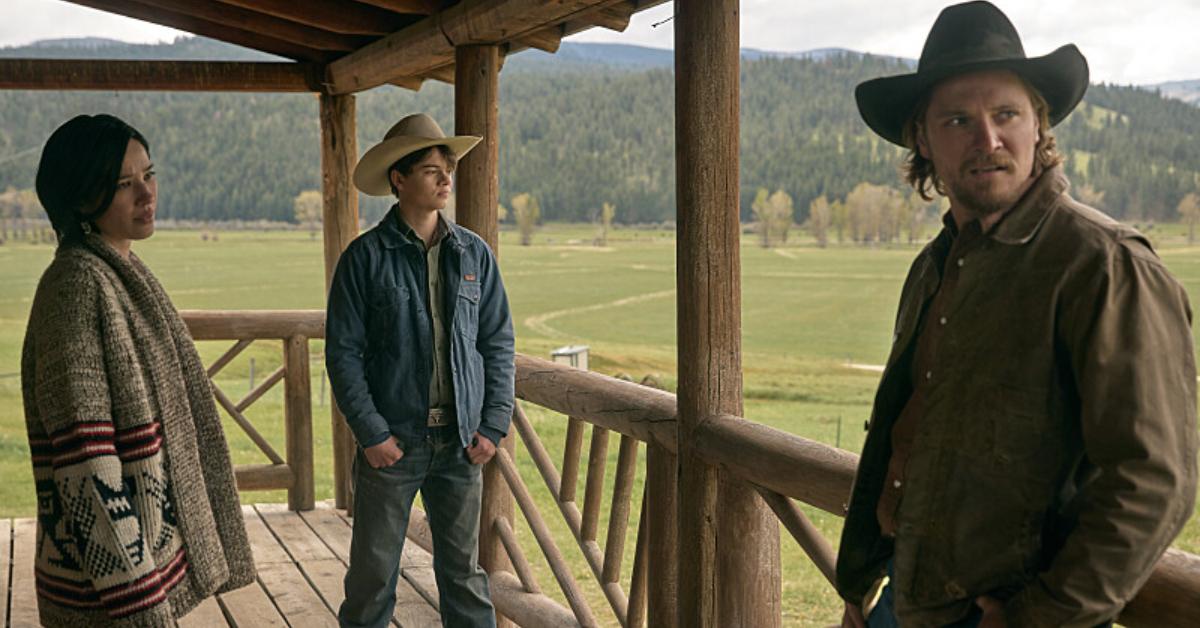 (L-R): Kelsey Asbille as Monica Long, Brecken Merrill as Tate Dutton, and Luke Grimes as Kacey Dutton on 'Yellowstone.'