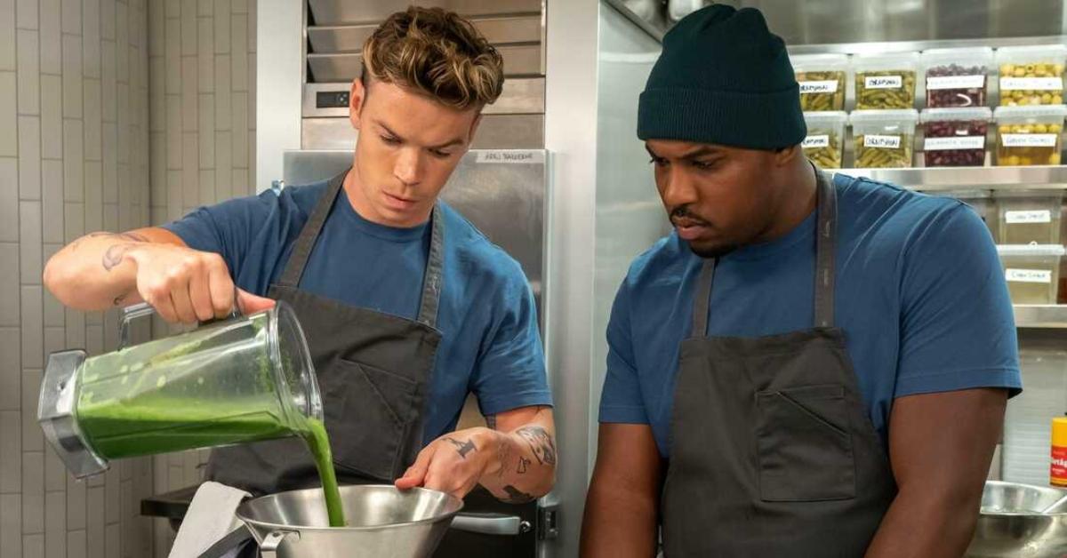 Lionel Boyce as Marcus and Will Poulter as Luca in 'The Bear'. Luca teaches Marcus cooking tips.