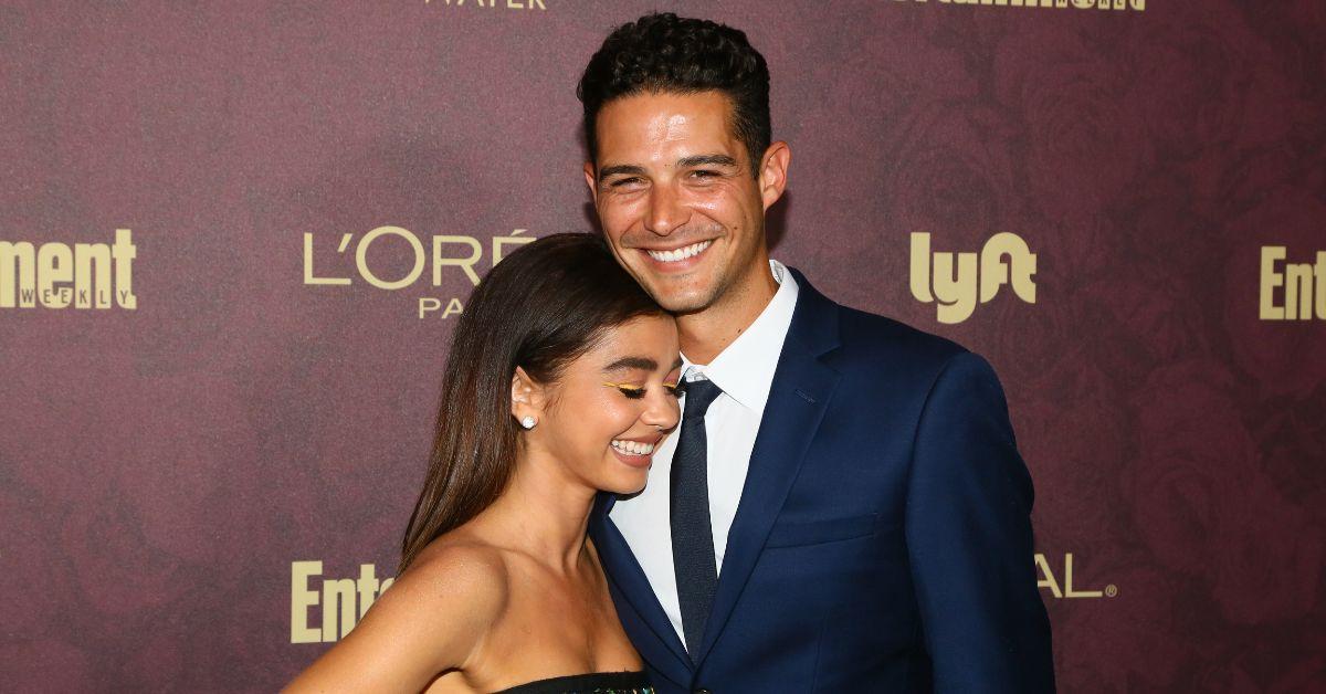 (l-r): Sarah Hyland and Wells Adams attending a red carpet event in 2018.