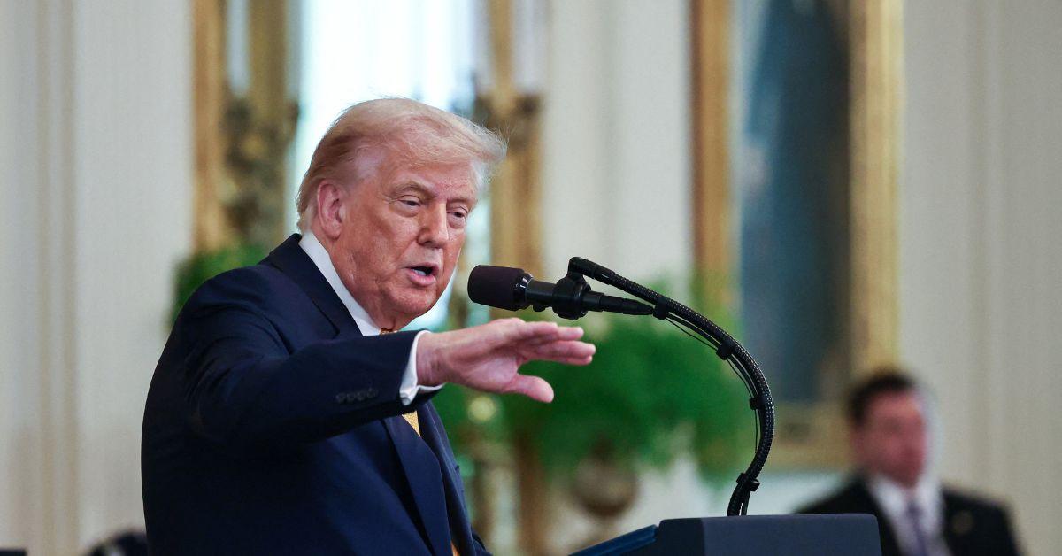 Donald Trump speaking at a podium in the White House. 