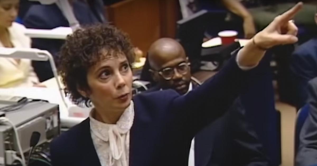 Marcia Clark during the O.J. Simpson trial. Christopher Darden is in the background.