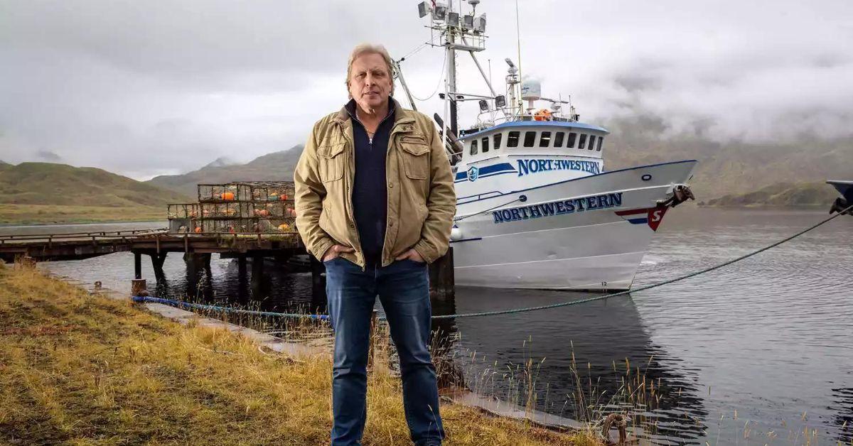 Sig Anderson poses in front of his boat, the Northwestern