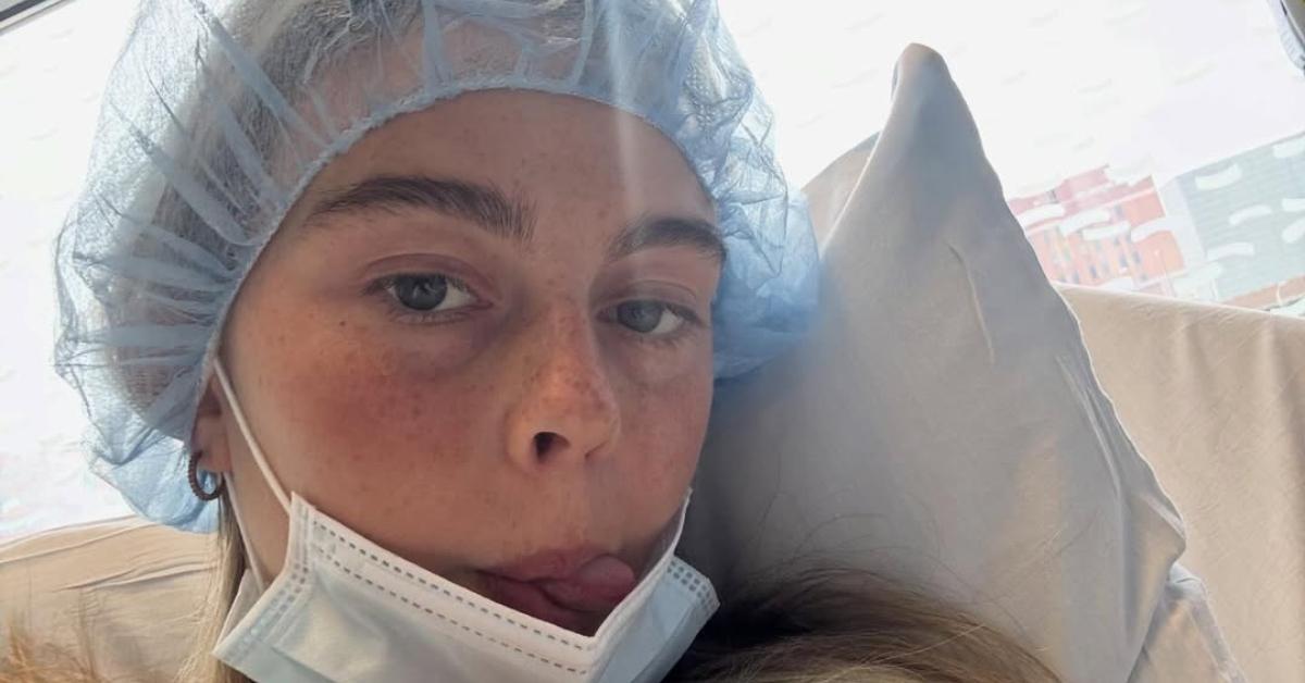 Sydney Towle takes a selfie from a hospital bed.
