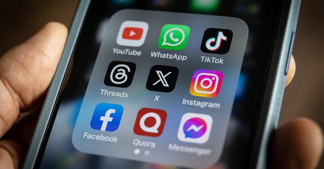 A Facebook app on a phone screen with other apps.