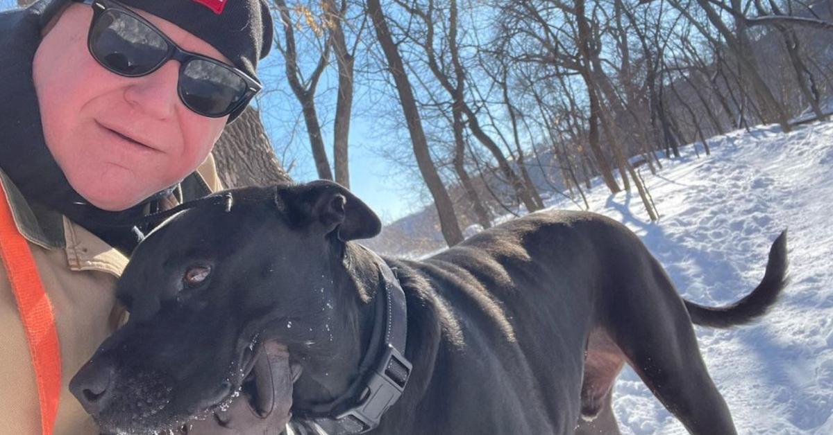 Tim Walz with rescue dog Scout outside