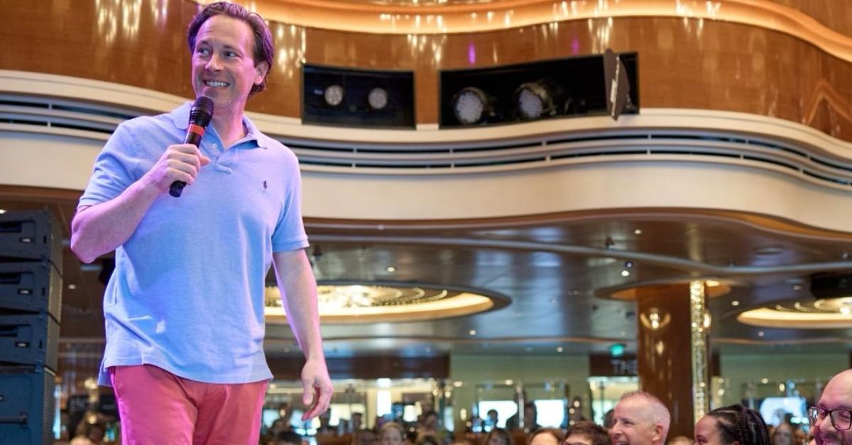 Ken Coleman speaking to an audience at a live event.