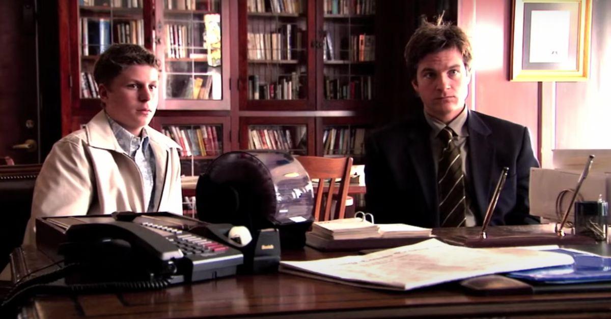 Michael Bluth and George Michael Bluth at a desk in an office on 'Arrested Development'