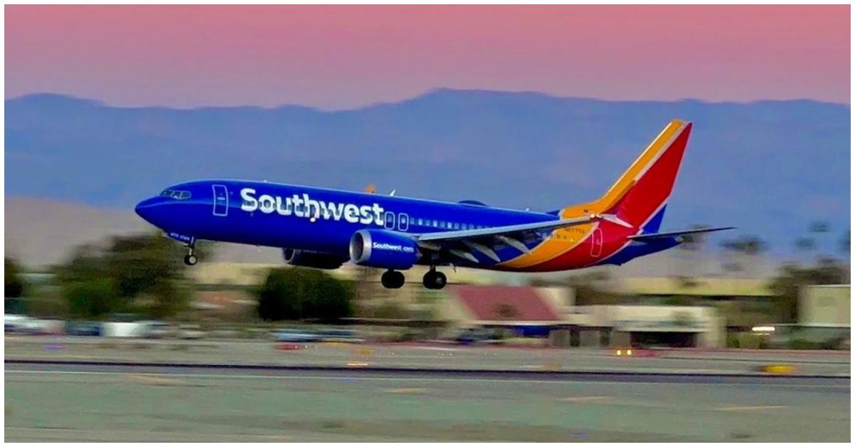 A Southwest airplane taking off on a runway