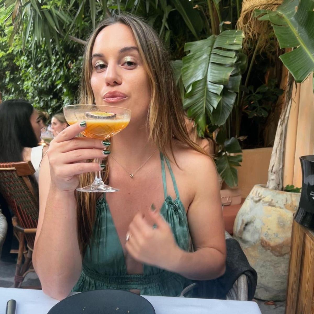 Hannah Berner sips a cocktail. 