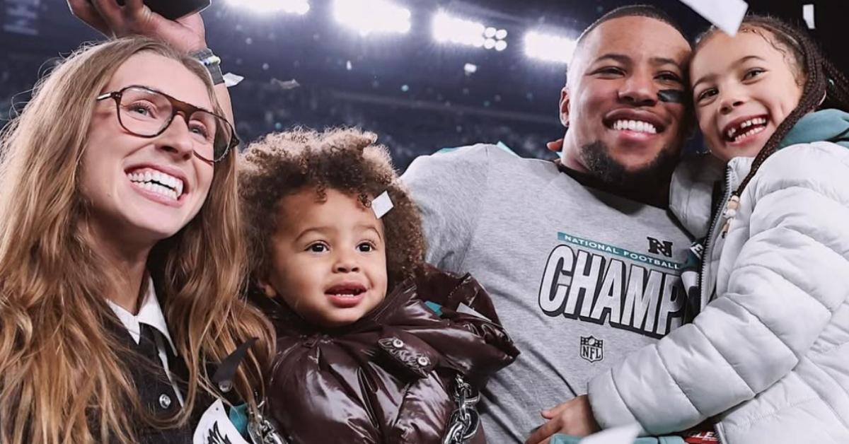 Saquon Barkley and his fiancee Anna Congdon, with their two children