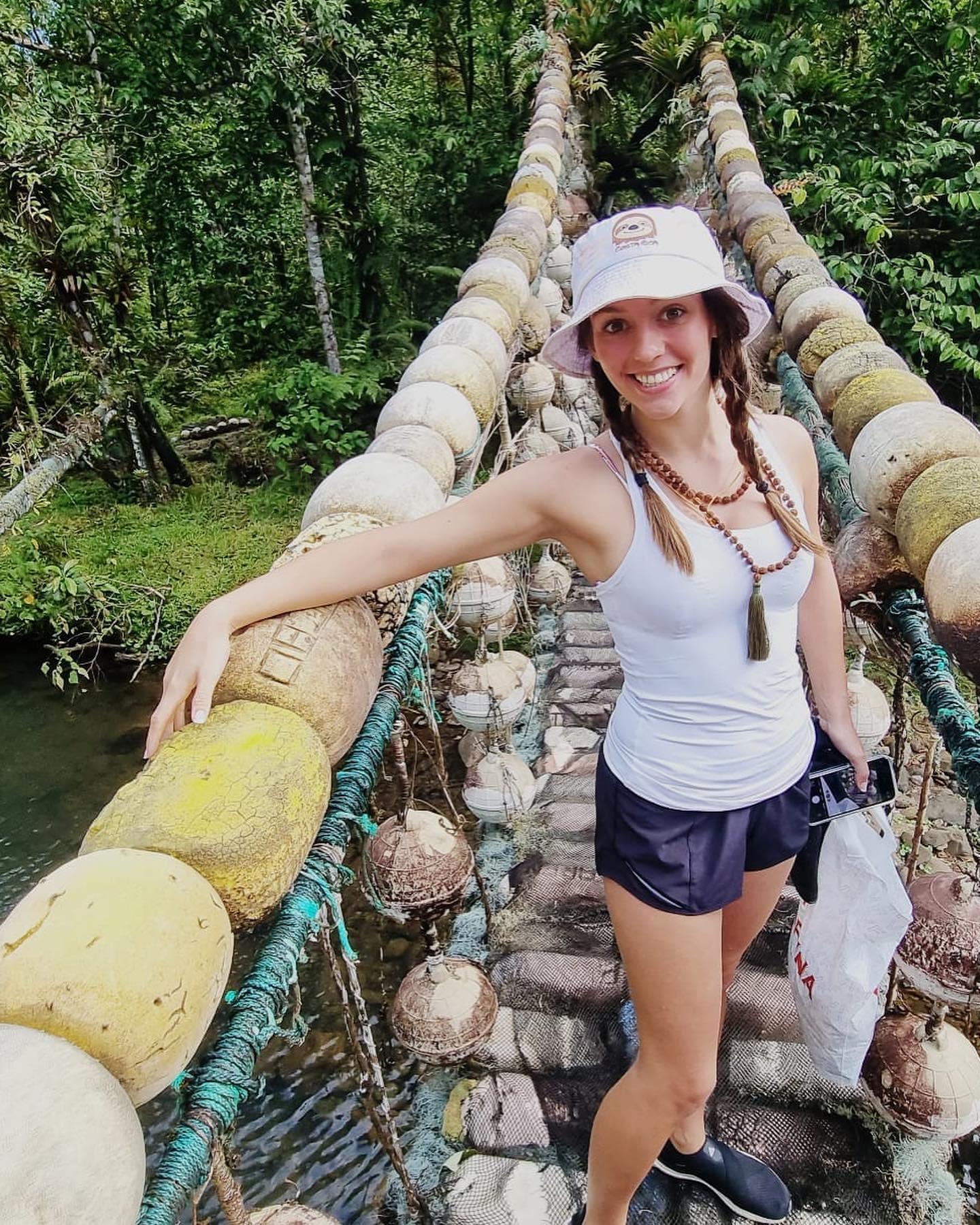 Jordon Hudson on a bridge