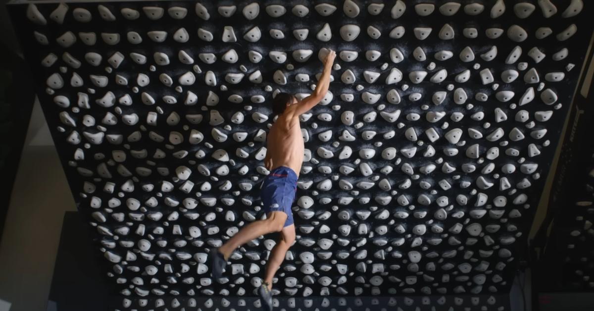 Alex Honnold climbs a rock wall