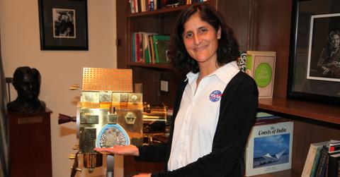 NEW DELHI, INDIA. Astronaut Sunita Williams a NASA explorer of Indian origin seen here with a scaled model of the Chandryaan 1 or the first Indian mission to the moon. Williams is slated to fly into space on the private rocket commissioned by NASA. . Indian women scientists and Engineers are playing an important role as they help the country fly its rockets, missiles and help fabricate satellites. One third of the work force at the Indian Space Research Organisation comprises of women and ladies are and reaching leadership positions. India's mission to Mars, Moon and the first Indian inter-continental ballistic missile all had women contributing in a big way, breaking the prevailing stereotype.. (Photo by Pallava Bagla/Corbis via Getty Images)