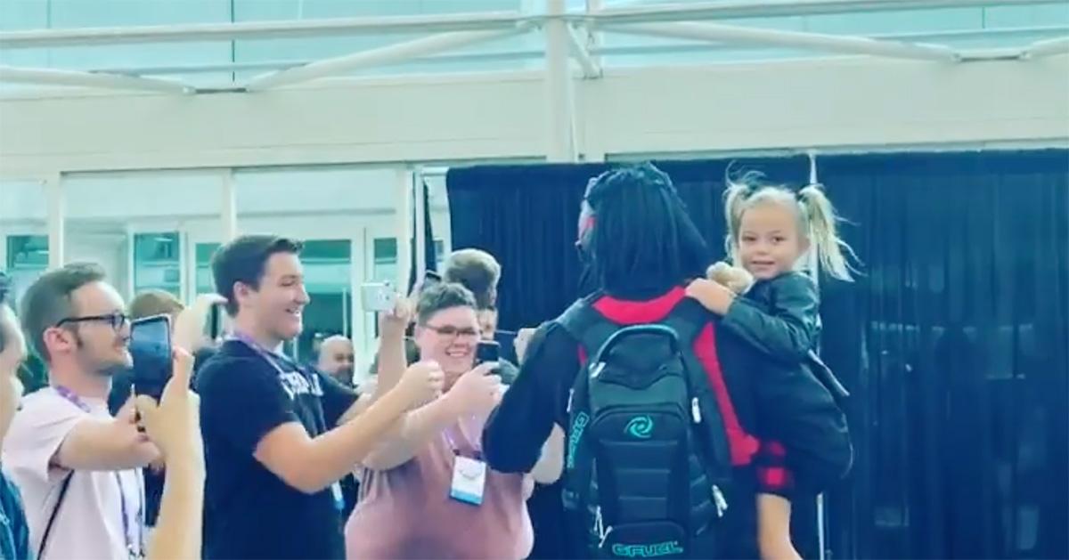 Dr Disrespect and his daughter meeting fans at a convention. 