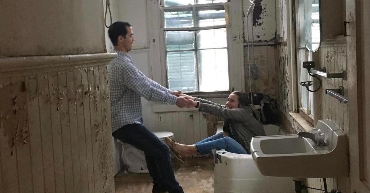 Michael and Ashley in the before pic of their Gustave Mayhoff cottage bathroom.