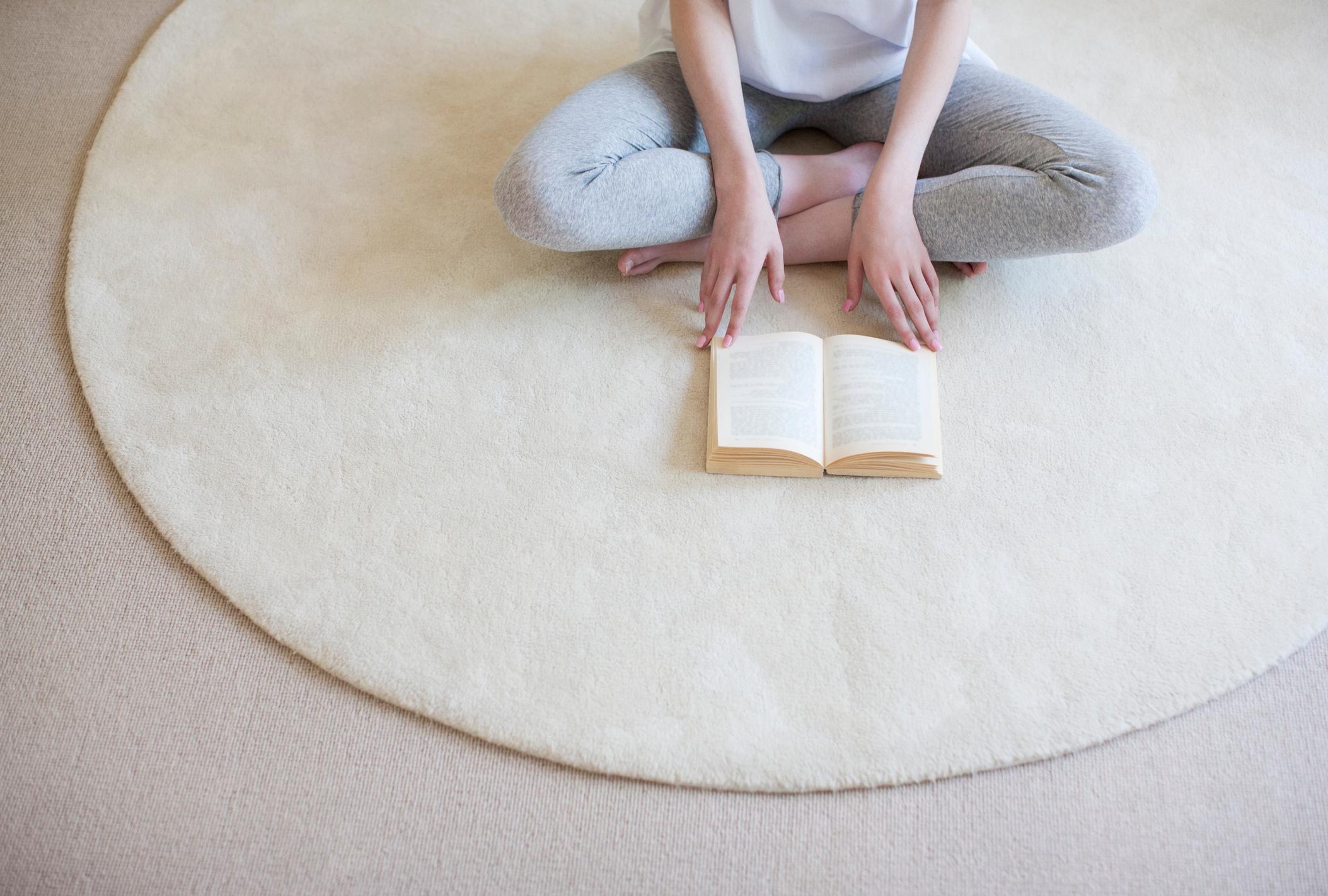 Woman reading on floor