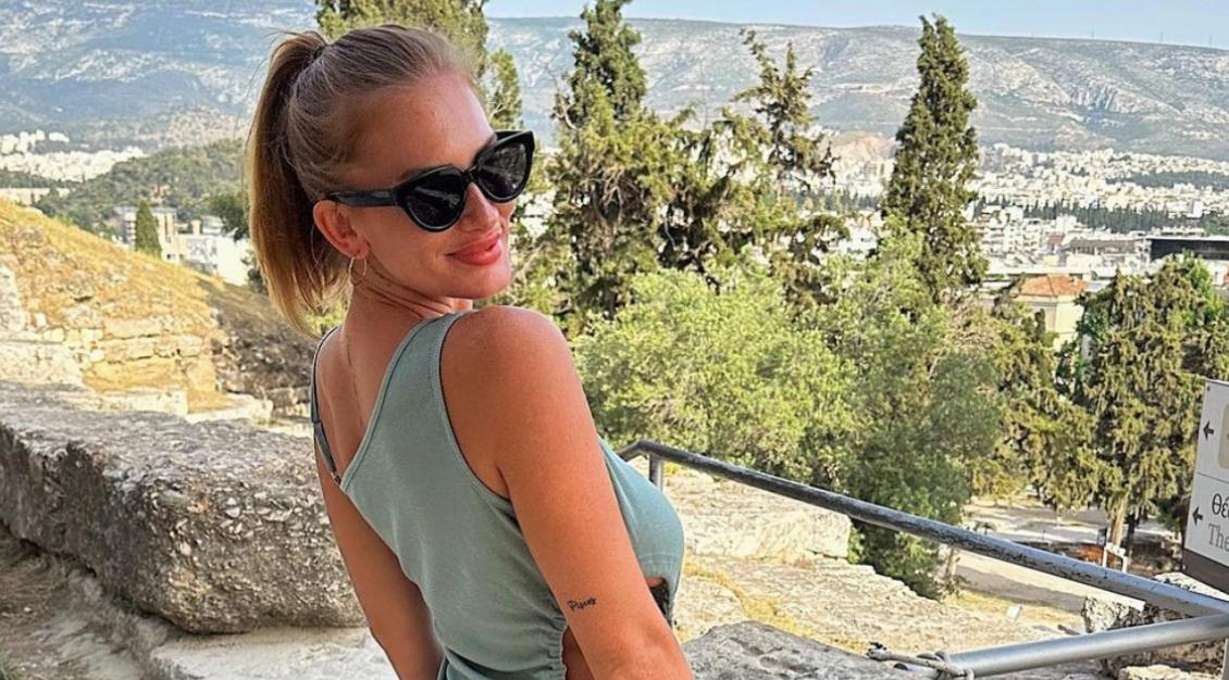 Temptation Island Single Makayla Halstead poses for an Instagram photo overlooking a city