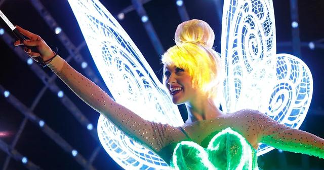Tinkerbell waving her wand at Disney Land in 2015.