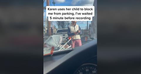 Viral video of an entitled Karen who decided to hold an open parking space with her baby stroller.