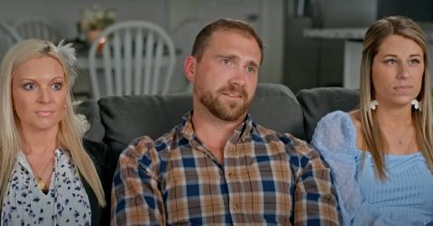 ‘You, Me & My Ex’ stars Chelsea, Matt, and Kenzie sit on a couch in their home