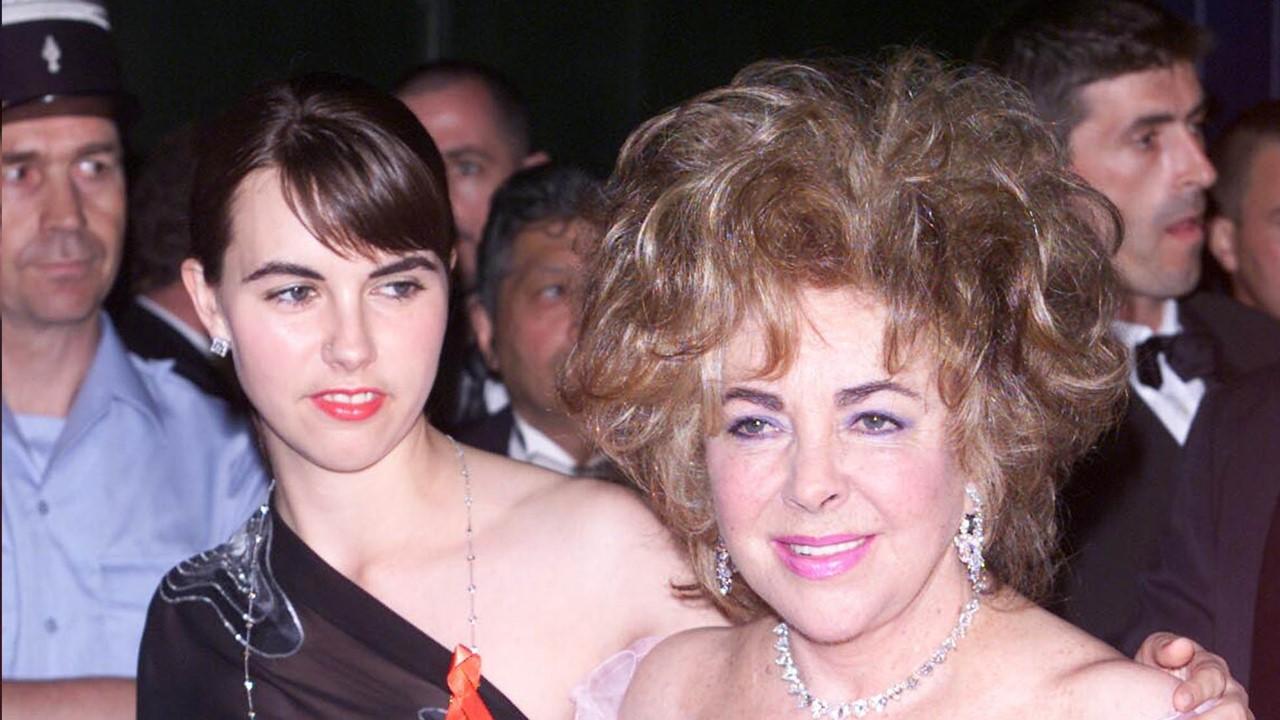 Elizabeth Taylor and her granddaughterattend the AMFAR dinner on May 10, 2001 