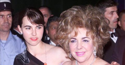 Elizabeth Taylor and her granddaughterattend the AMFAR dinner on May 10, 2001