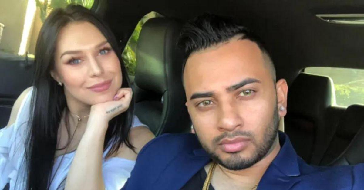 Shawn Isaac and Kate London pose for a selfie in a car